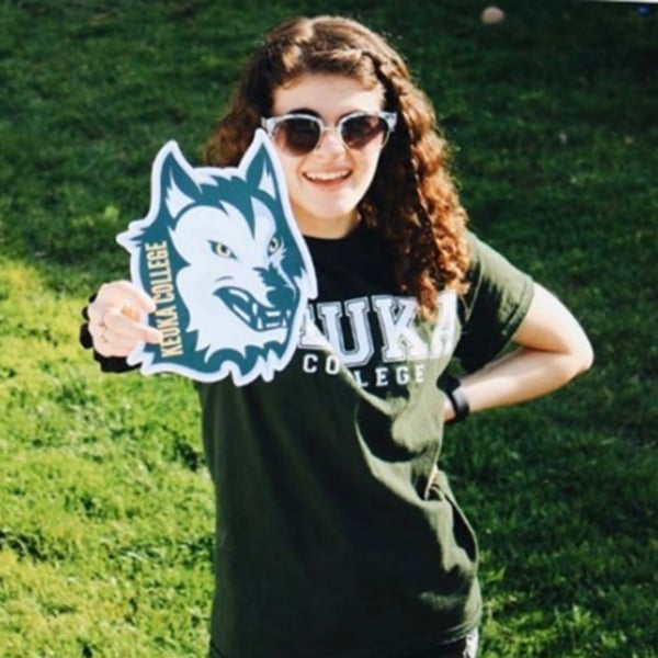 ASD student holding Pure Wolf Banner