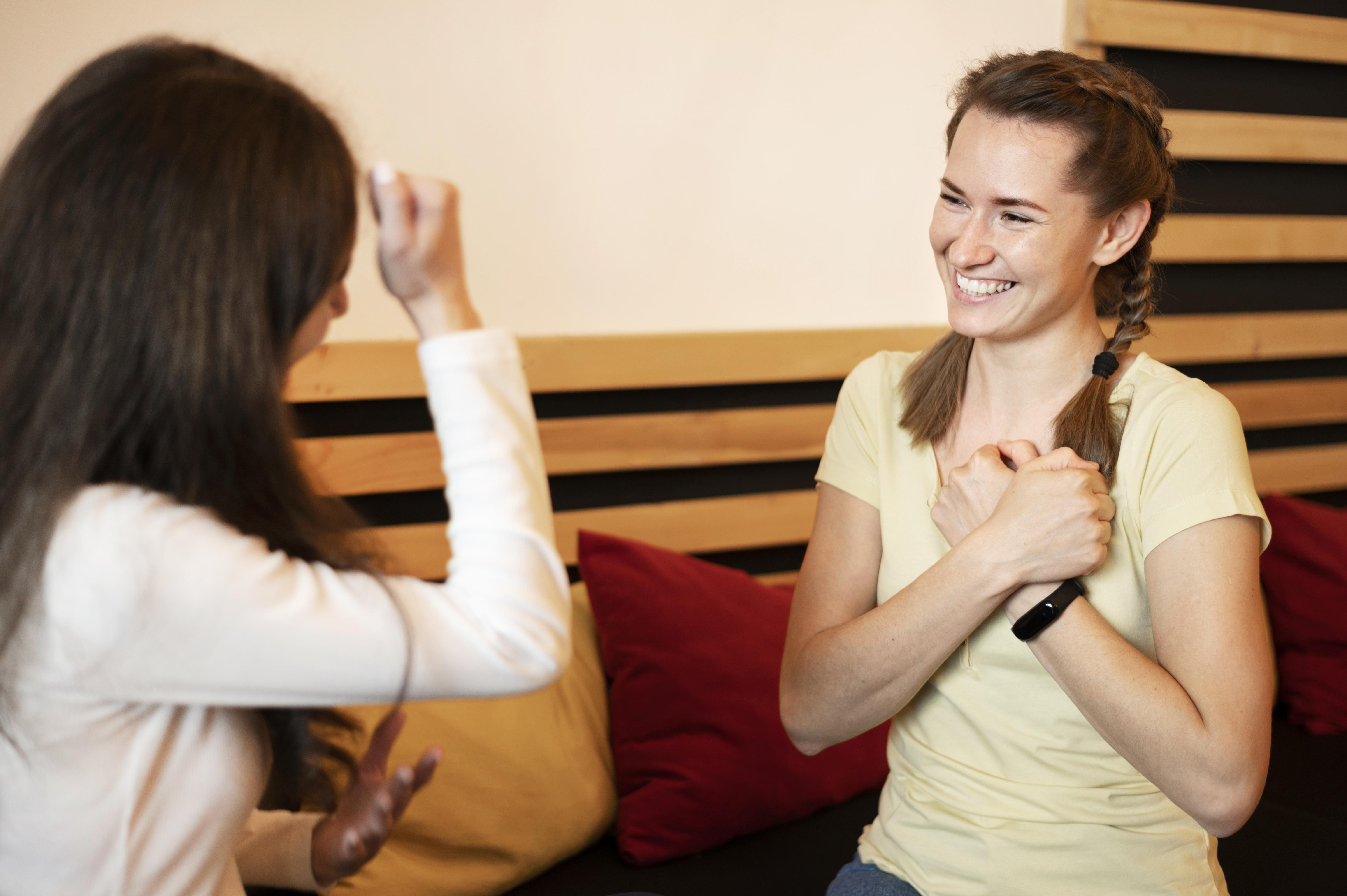 Young woman using sign language