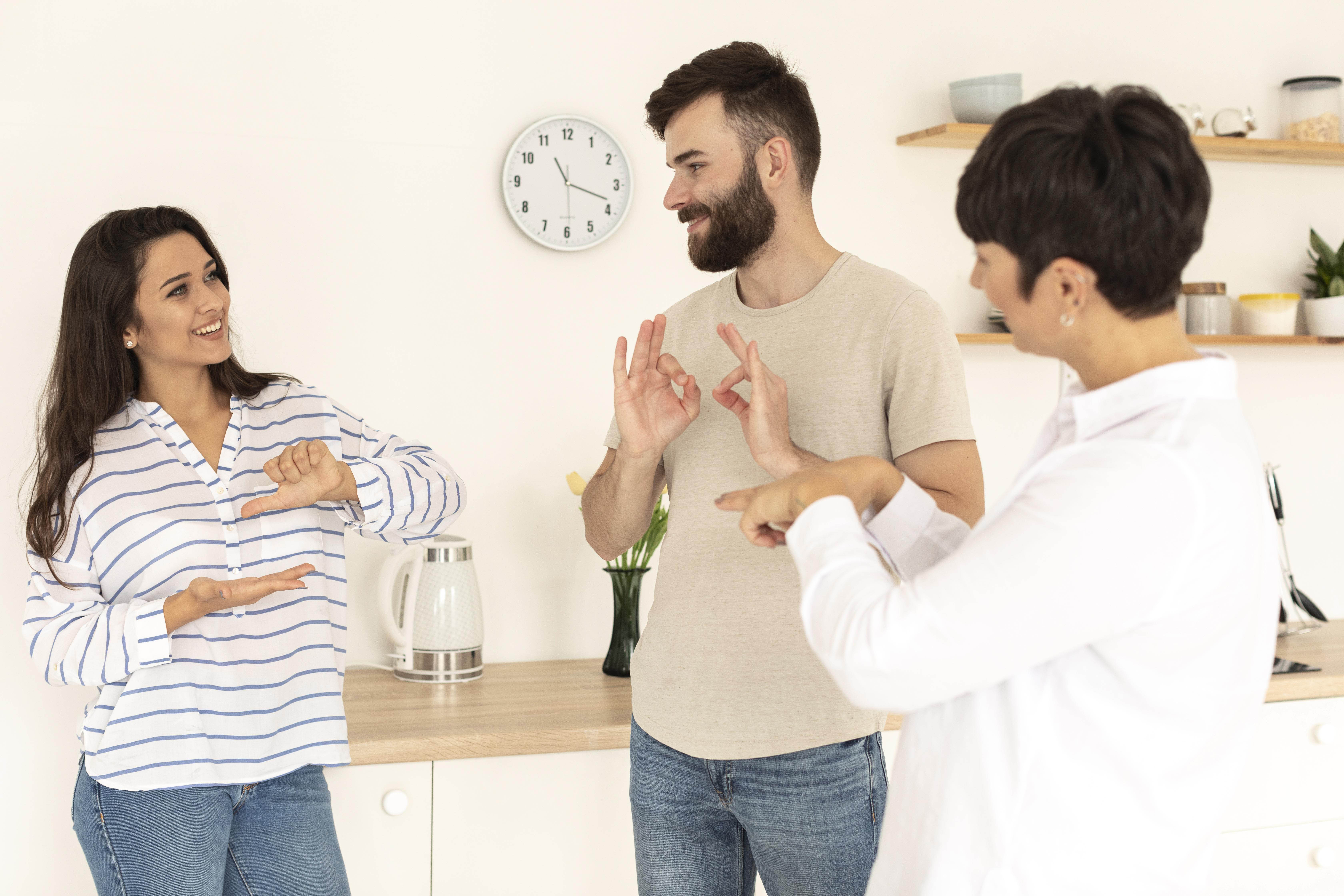 Group of people using sign language