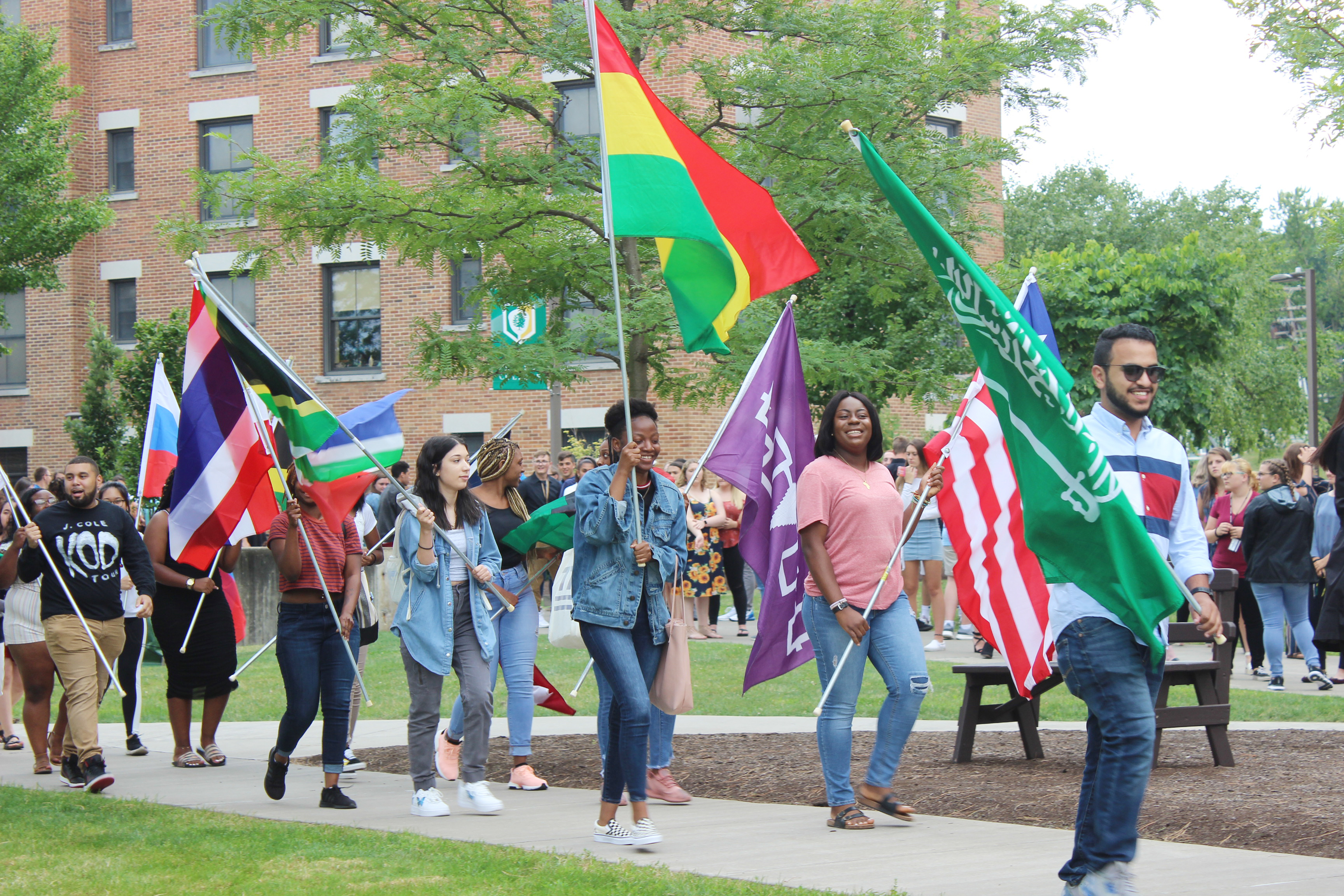 Students carrying flags to Academic Convocation 