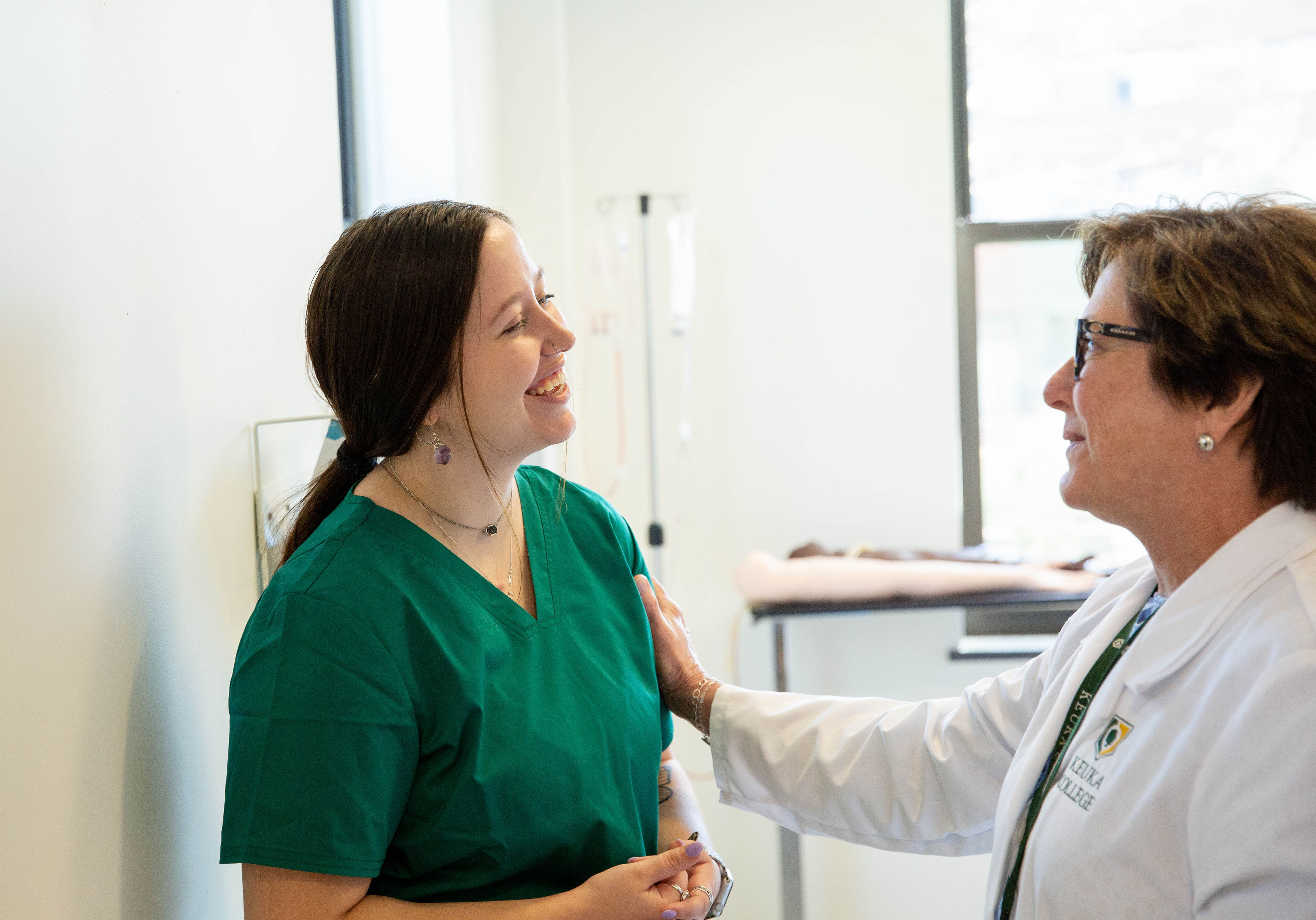 Nursing Faculty speaking with a student
