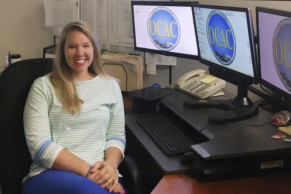 Lauren Schreyack sits at her desk