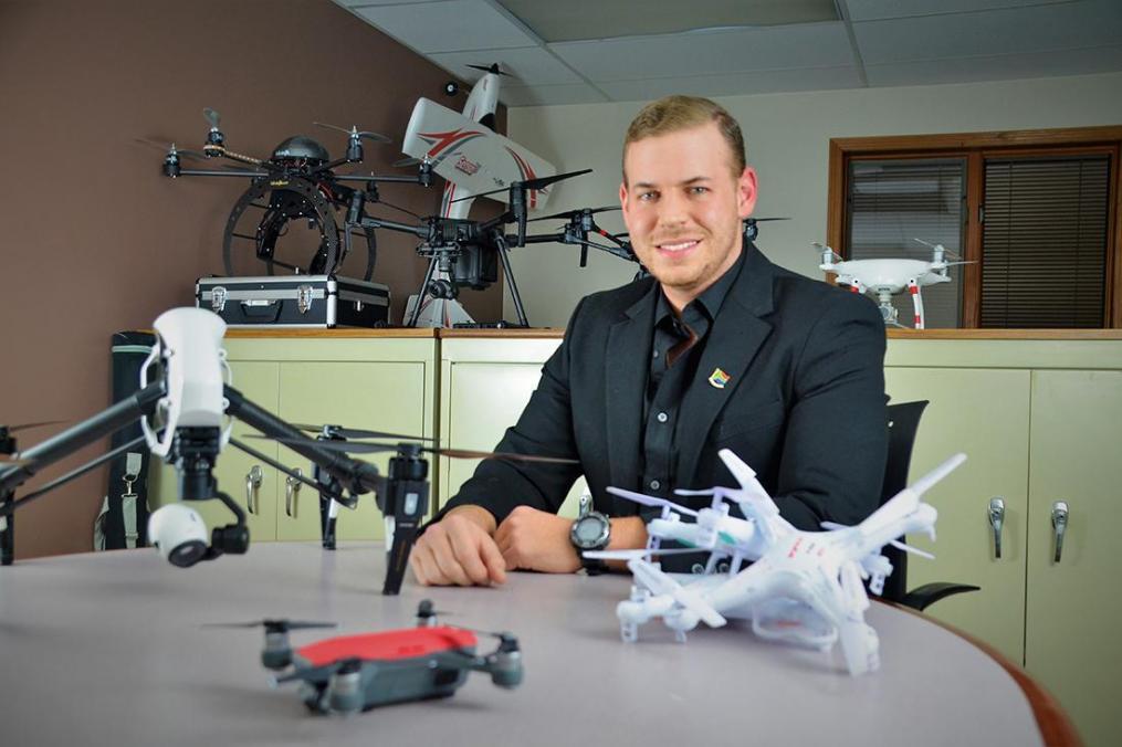 Stuart Carmichael-Green ’16 sits with drones
