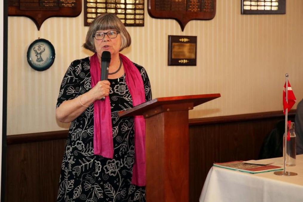 woman speaking at a podium