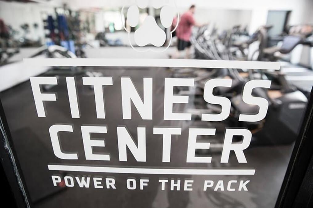 Fitness Center door with work out machines in the background