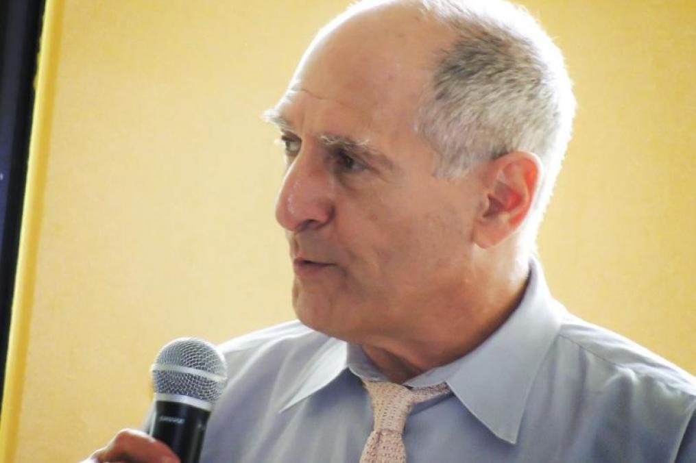 man speaking into a microphone