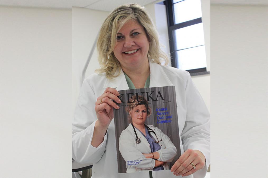 Dr. Elizabeth Russo '98, chair of the Division of Nursing, poses with a copy of the first Keuka College magazine, published in the spring of 2000. Dr. Russo was on the cover.