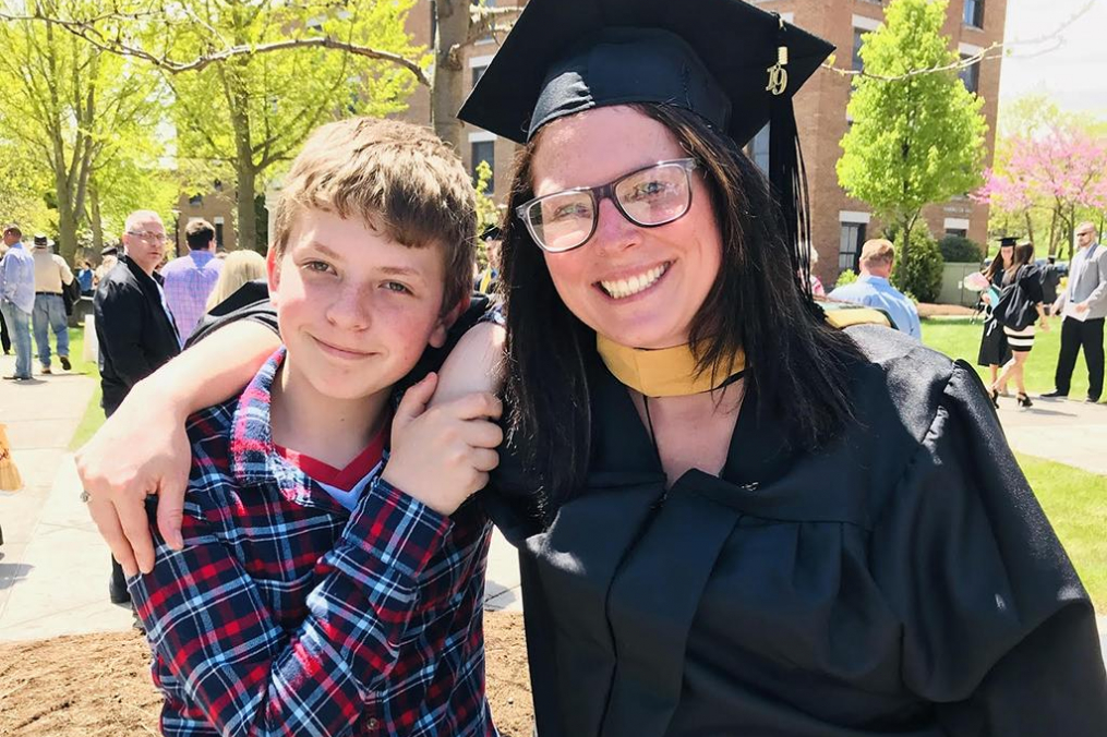 Angie Laursen Burd ’09 ’M19 poses with her son, Maison, following her Keuka College graduation this past May. 