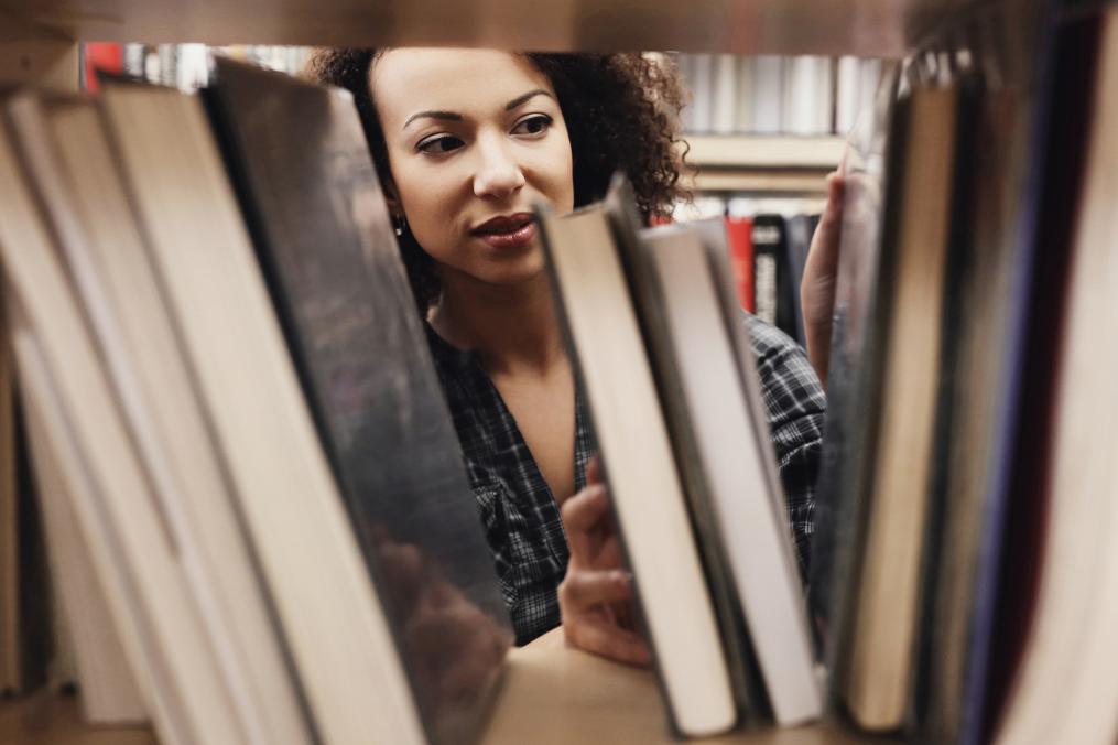 student searching for a book