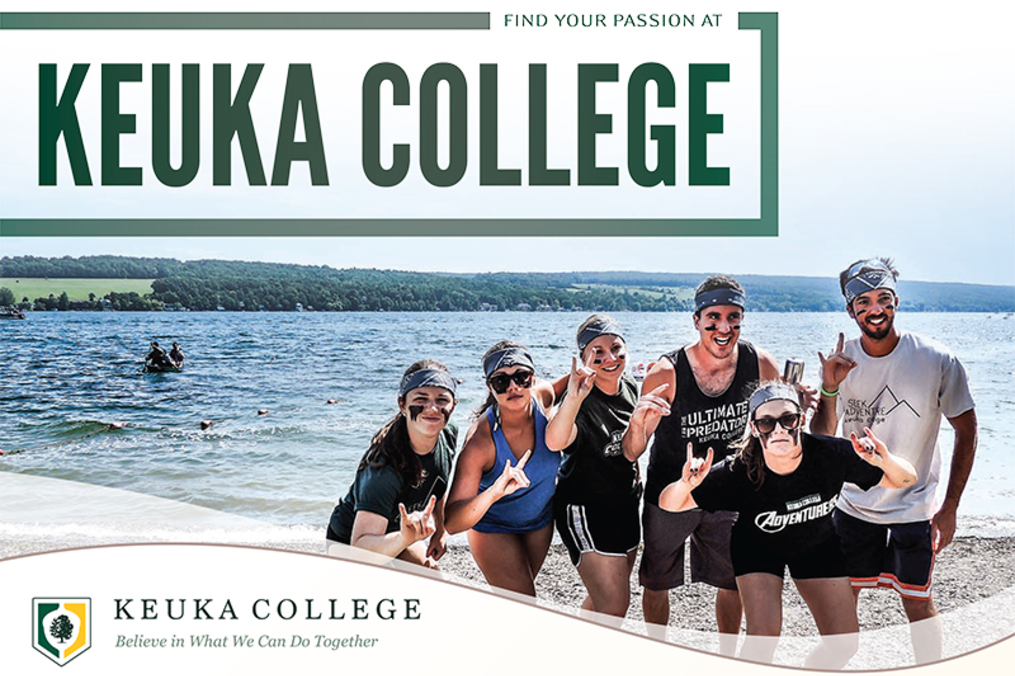 students posing in front of the lake