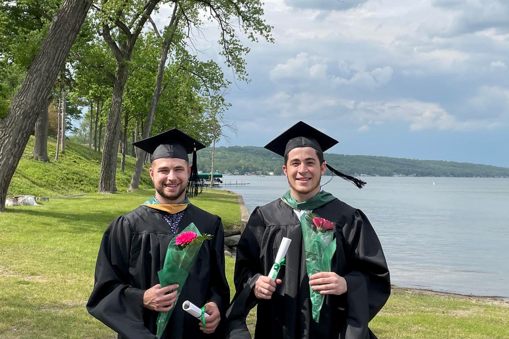 Alex and Michael Leljedal in their graduation gowns 