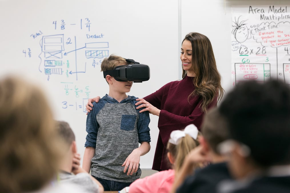 Student working with teacher using Virtual Reality technology 
