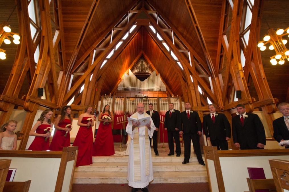 photo of bridesmaids and groomsmen standing inside the chapel