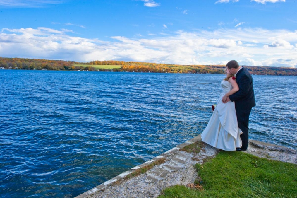 Bride and Groom standing near the water on Point Naemo