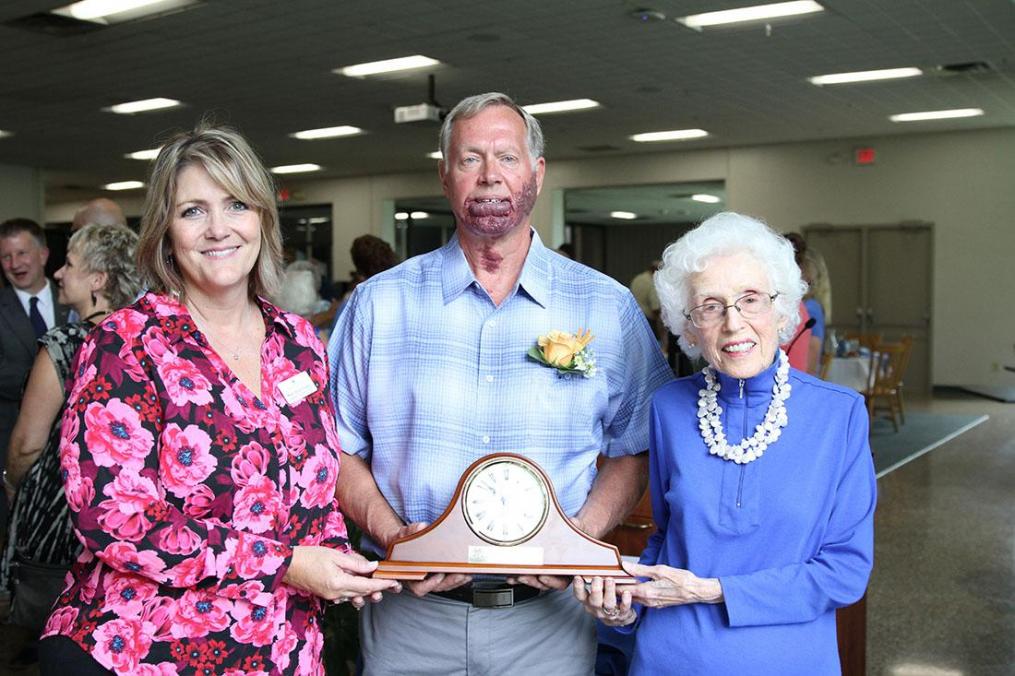 Mary Anne Rogers (l), co-chair of Keuka College's Community Associates Board, and Corrine Stork (r) present the 2019 Stork Award to Penn Yan resident Norm Koek. The award was named after the first recipients Penn Yan residents Corinne Stork and the late Donald Stork, in 1991.