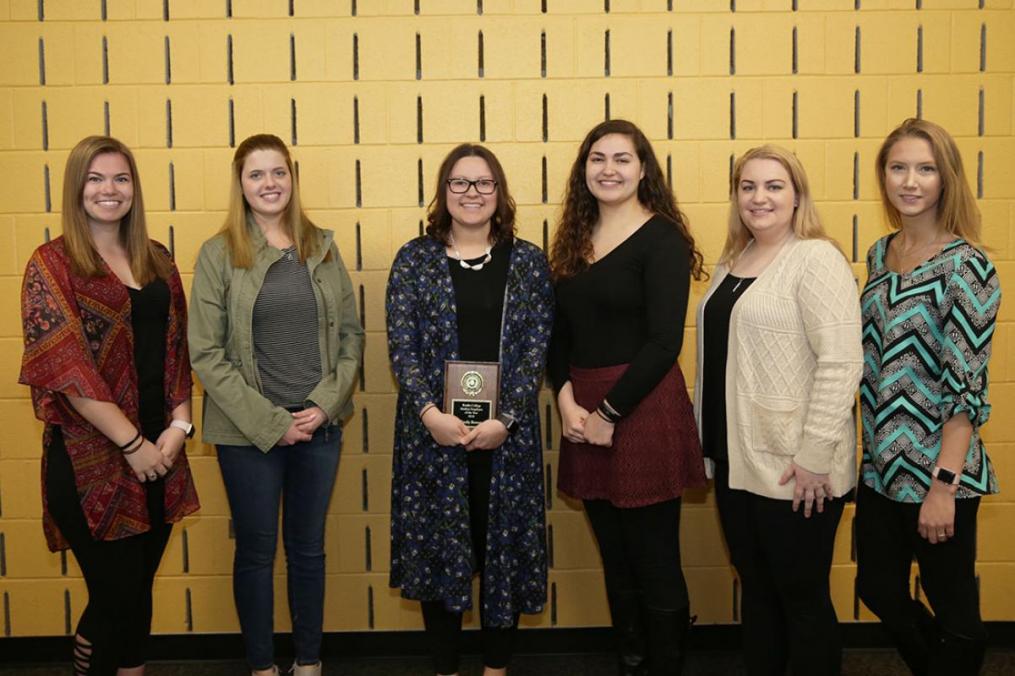 Seven students were nominated for Student Employee of the Year. The nominees are, from left: Jessica Hedges '20, Monica Sturm '20, Student Employee of the Year Emily Bower 18, Kellianne Mohorter '18, Erinn Peterson '19, and Taylor Jewell '19. Missing from the photo is Danielle DeSimone '19.
