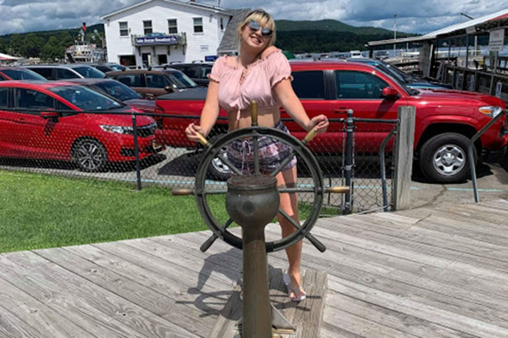 Olivia Ennist '20, take the opportunity for this photo op near Ft. William Henry in Lake George. "While I was there, I talked to some locals who explained the historical significance of the water. They pointed me to the fake boat wheel for a photo," says Olivia.