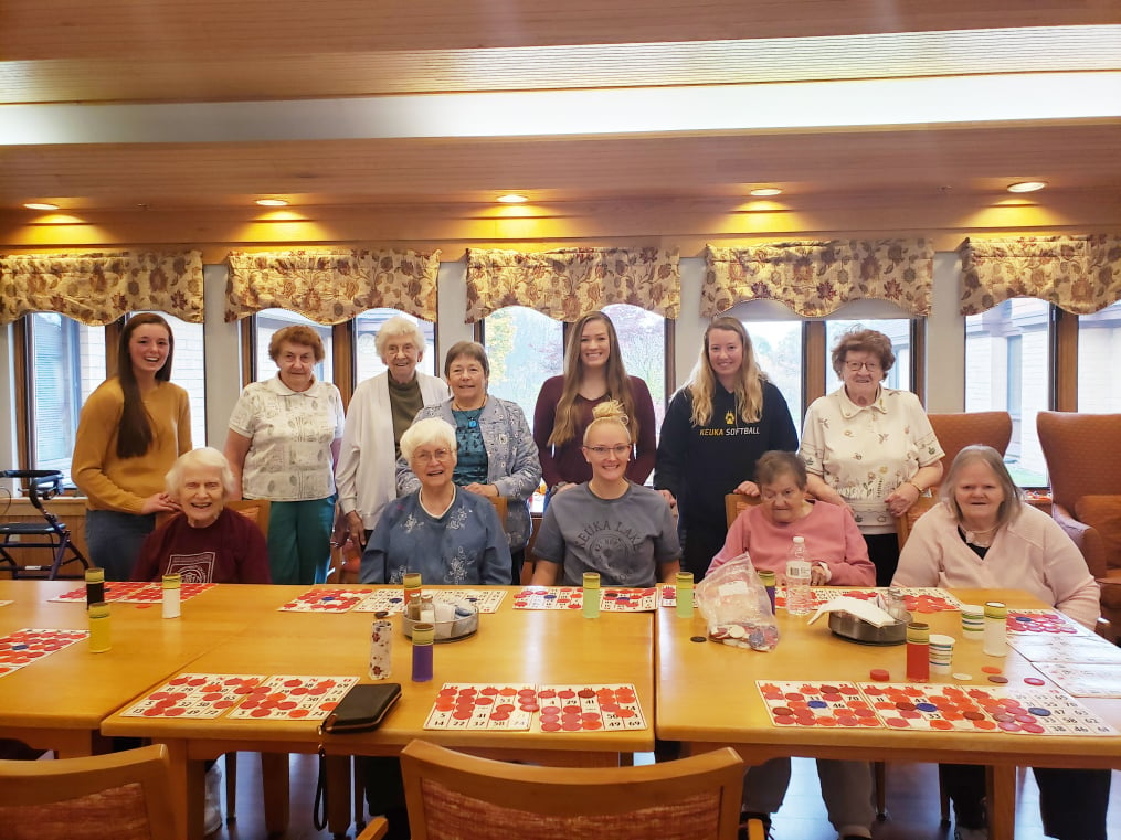These Keuka College students, visiting residents at Clinton Crest Manor, were among the 44 members of the College community participating in Make a Difference Day. 