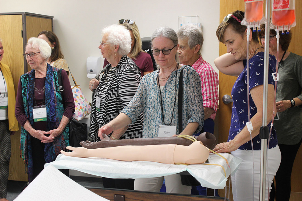 Guests including Denise McClellen, center, tour the new Nursing labs in Harrington Hall on Saturday, Sept. 28. 