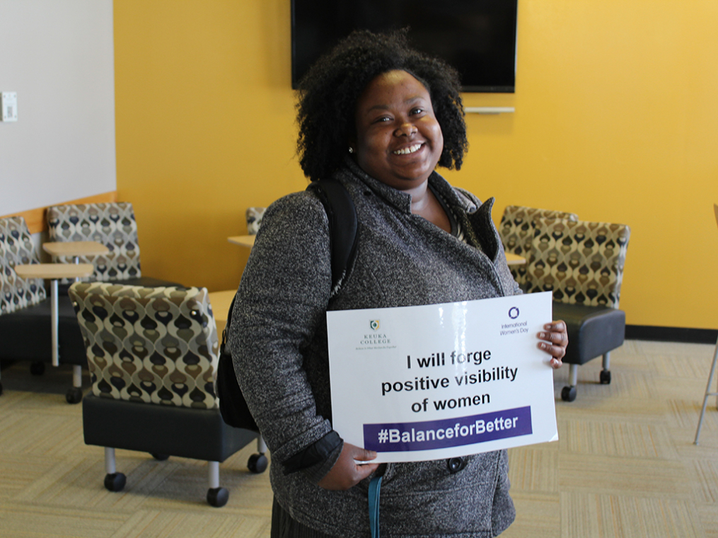 Keuka College students, faculty, staff, and supporters commemorated International Women's Day on Friday, March 8, by taking photos with “selfie cards” proclaiming strategies for progress.