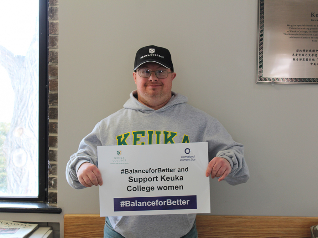 Keuka College students, faculty, staff, and supporters commemorated International Women's Day on Friday, March 8, by taking photos with “selfie cards” proclaiming strategies for progress.