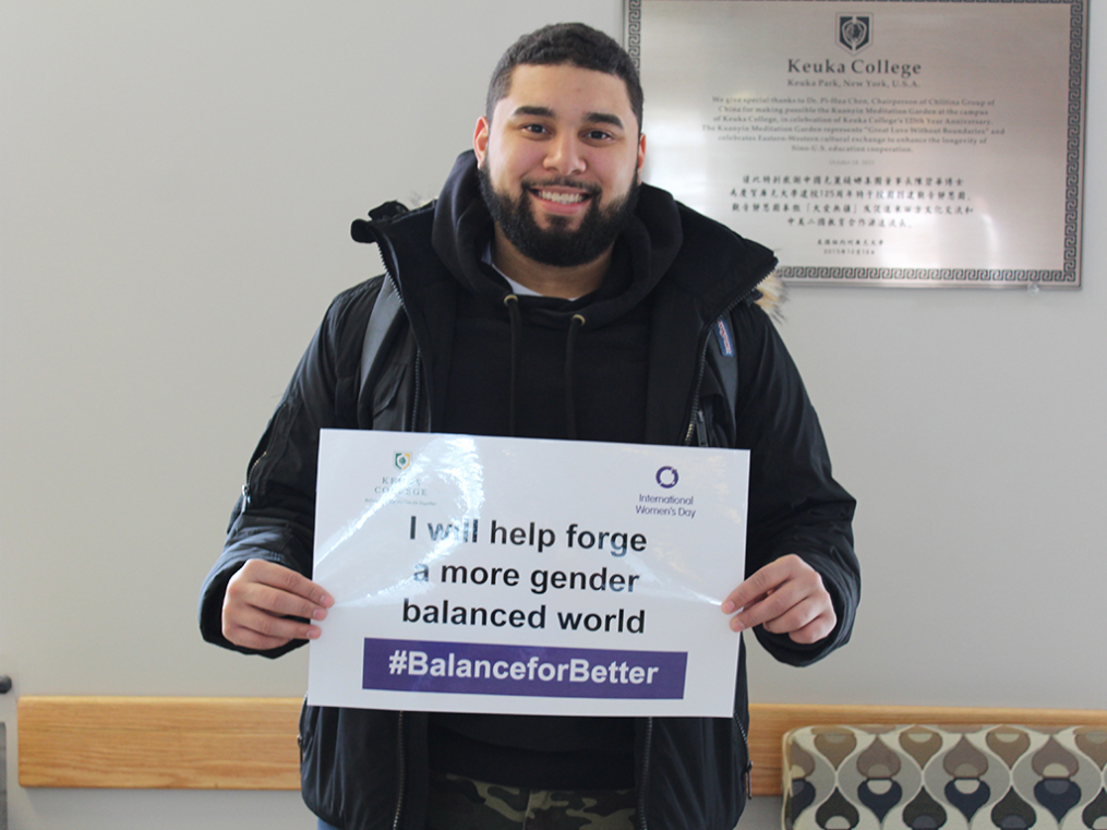 Keuka College students, faculty, staff, and supporters commemorated International Women's Day on Friday, March 8, by taking photos with “selfie cards” proclaiming strategies for progress.