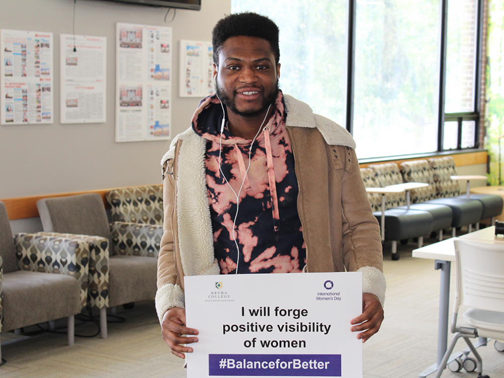 Keuka College students, faculty, staff, and supporters commemorated International Women's Day on Friday, March 8, by taking photos with “selfie cards” proclaiming strategies for progress.