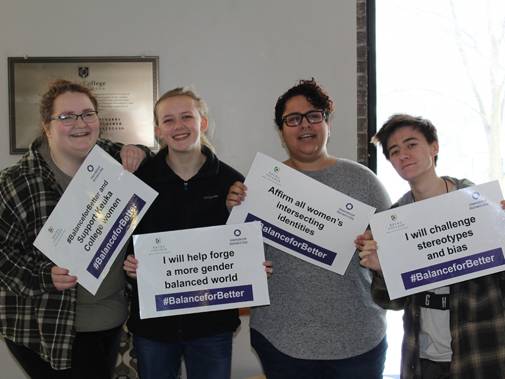 Keuka College students, faculty, staff, and supporters commemorated International Women's Day on Friday, March 8, by taking photos with “selfie cards” proclaiming strategies for progress.
