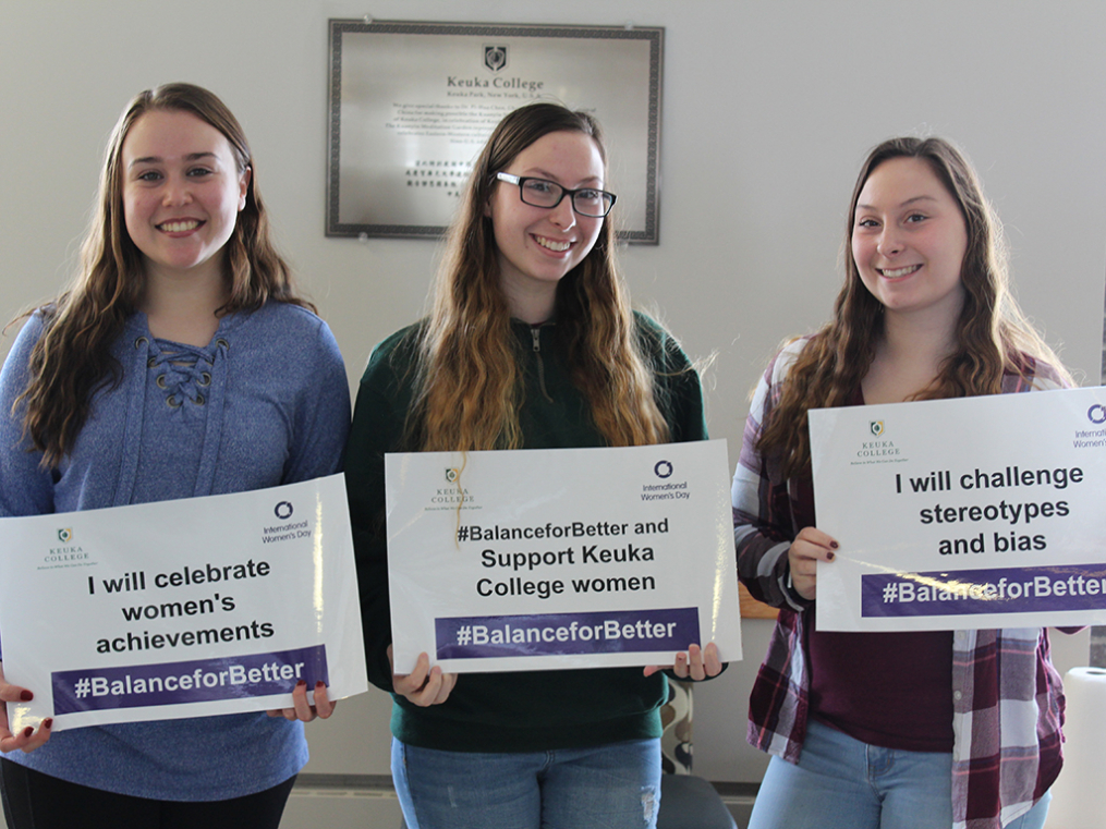 Keuka College students, faculty, staff, and supporters commemorated International Women's Day on Friday, March 8, by taking photos with “selfie cards” proclaiming strategies for progress.