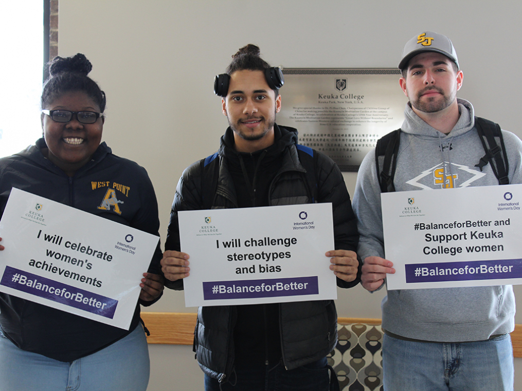 Keuka College students, faculty, staff, and supporters commemorated International Women's Day on Friday, March 8, by taking photos with “selfie cards” proclaiming strategies for progress.