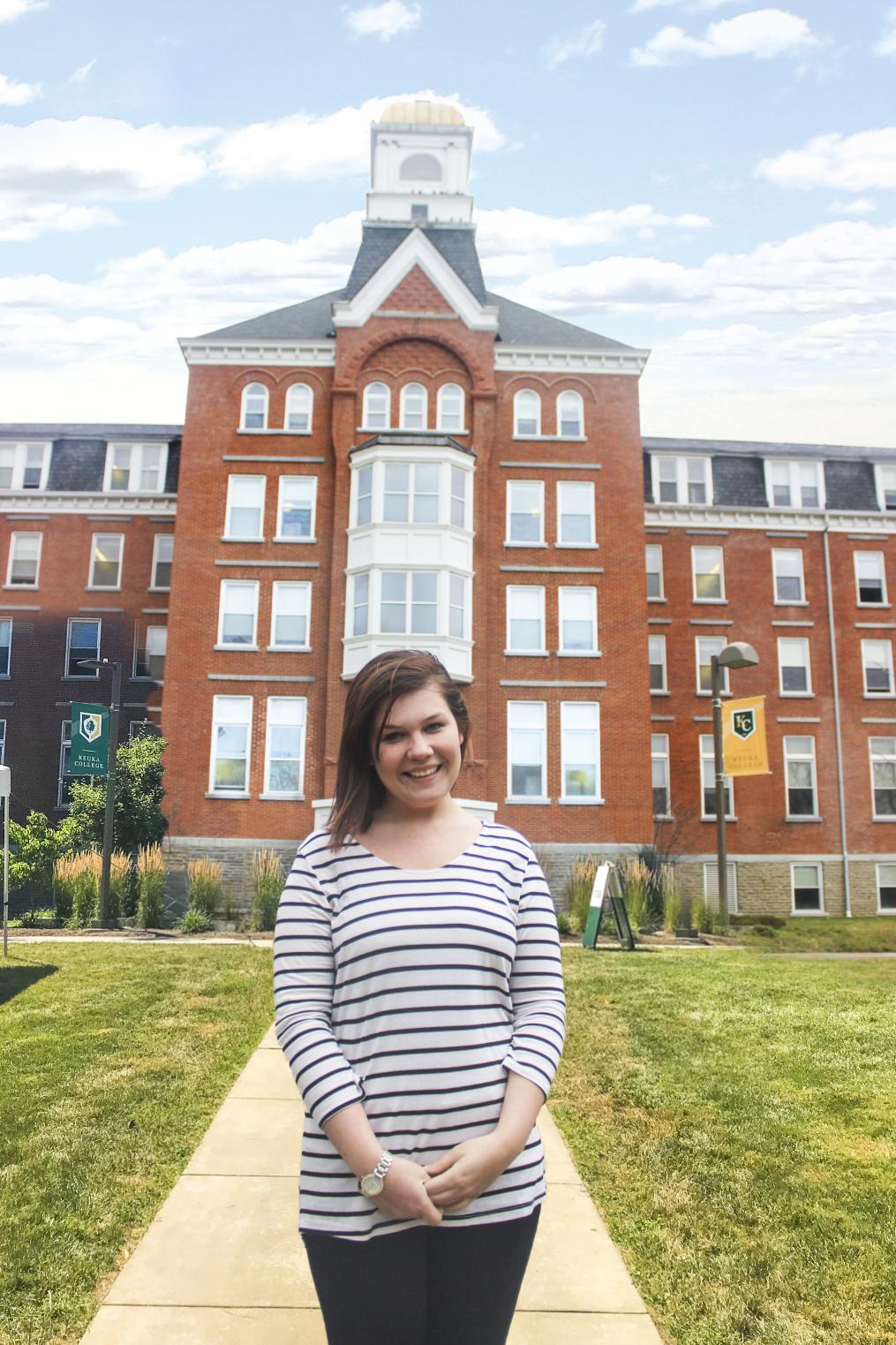 Myra standing in front of Ball Hall