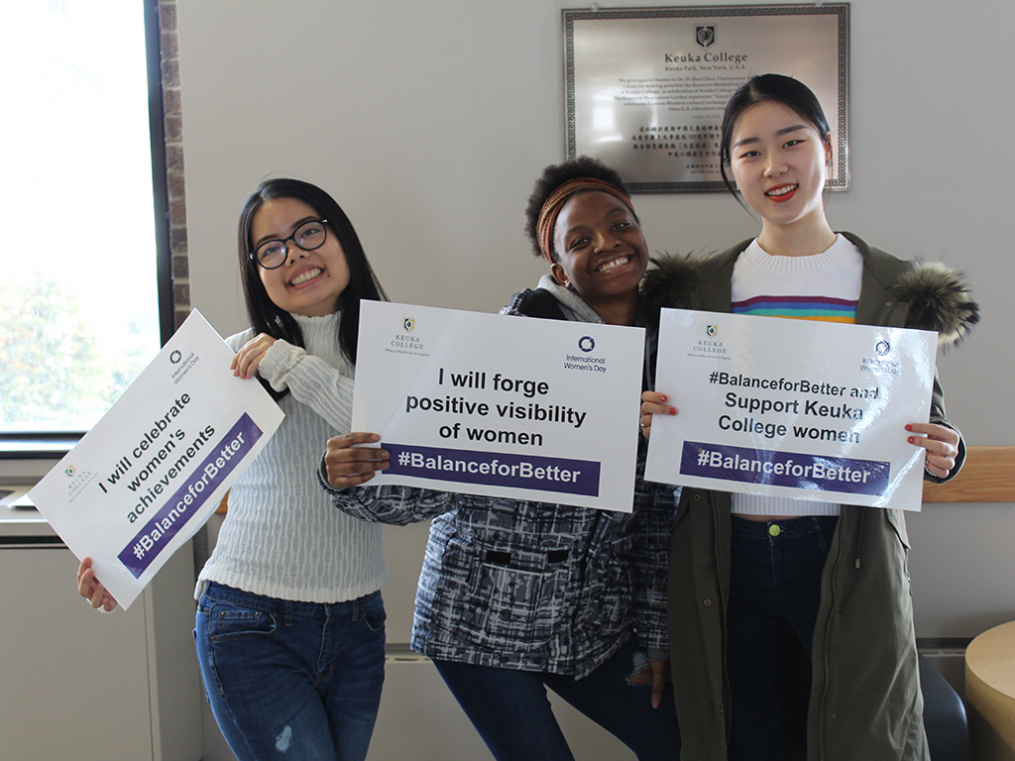 Keuka College students, faculty, staff, and supporters commemorated International Women's Day on Friday, March 8, by taking photos with “selfie cards” proclaiming strategies for progress.