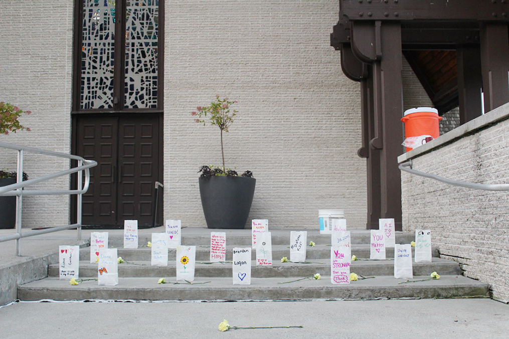 Luminaries are placed on the steps of Norton Chapel during the 2017 One Walk. The bags have messages of hope, love, and support for those affected by suicide.
