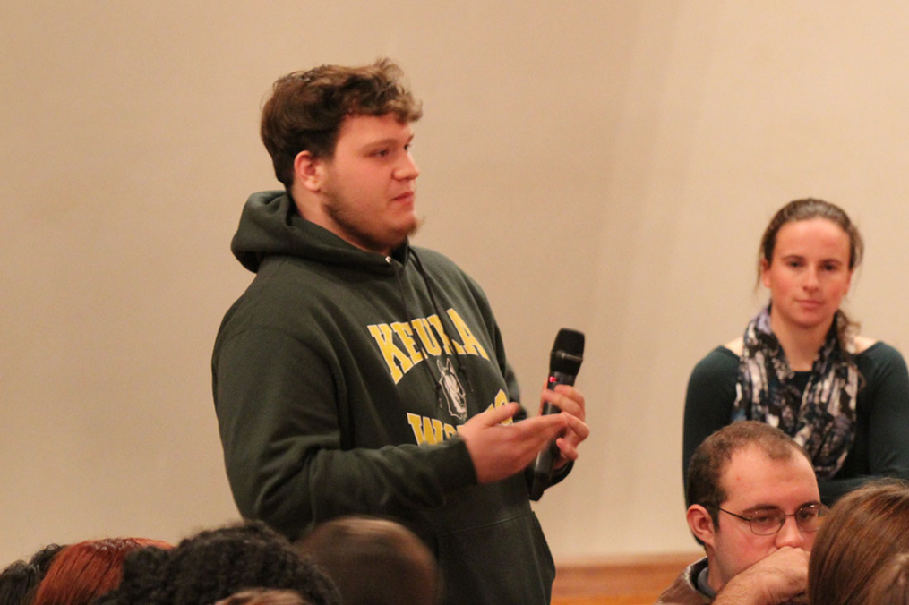 A student asks a question during the Q&A session following the performance.