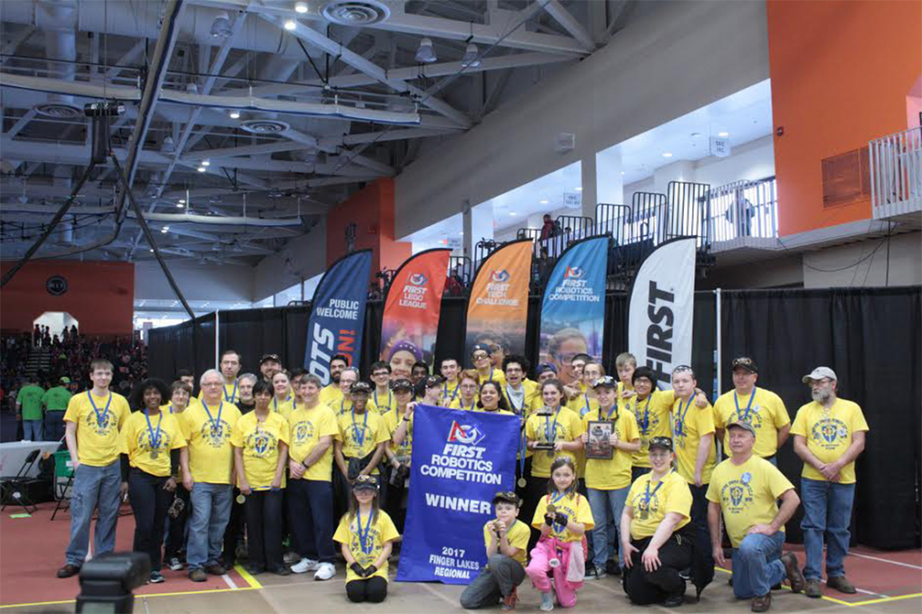 Team members post with friends, family and supporters after capturing first place in the Finger Lakes Regional FIRST Robotics competition, held in March in Rochester. The Elmira team shared top honors with teams from Rochester and Spencerport.