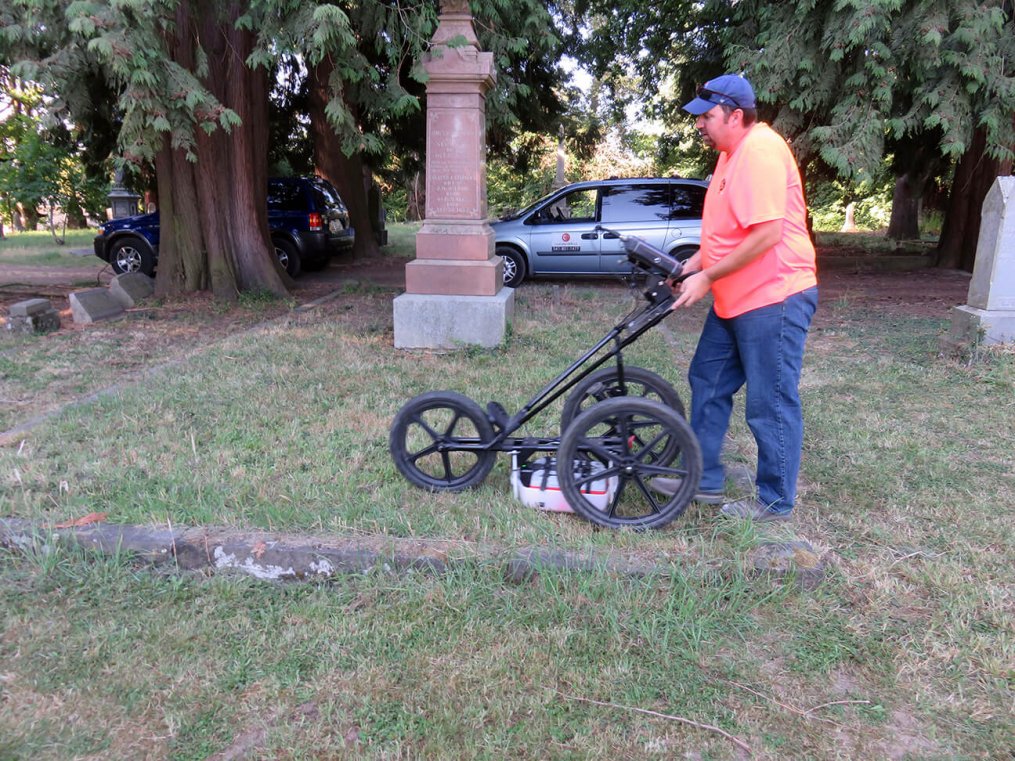 Jeff Sohlstrom of Concrete GPR using ground penetrating radar to search underground.  Both Reid and Jeff used different frequencies to do multiple searches in the plot.