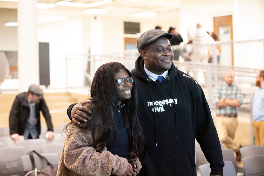 Jamal Hodge poses with student after the event