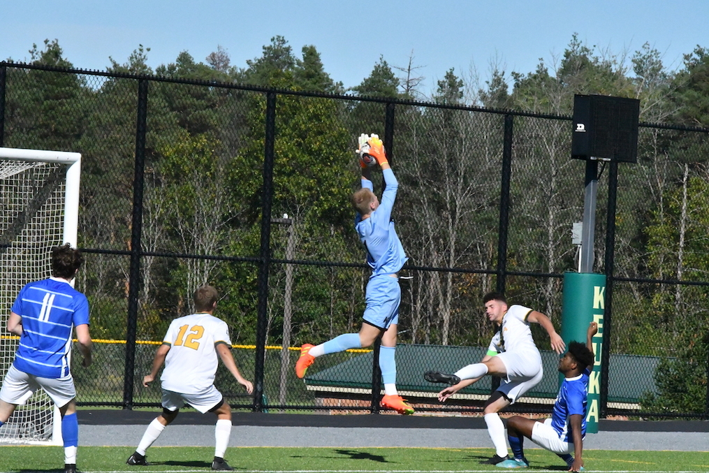 Cameron Smith catching a ball in the air during a KC soccer match 