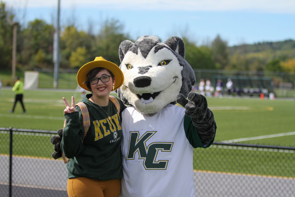 Kacey and a student posing together at last year's Green and Gold event.