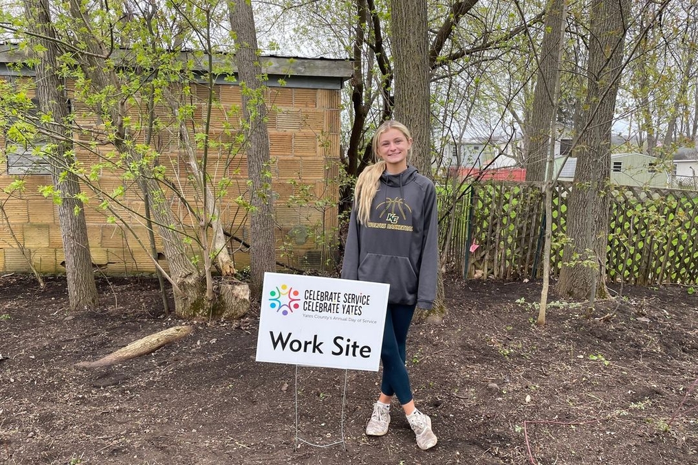 KC Student posing at non-profit work site 