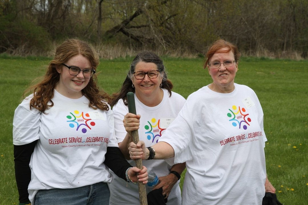 CSCY volunteers posing with their shovel as they complete community service
