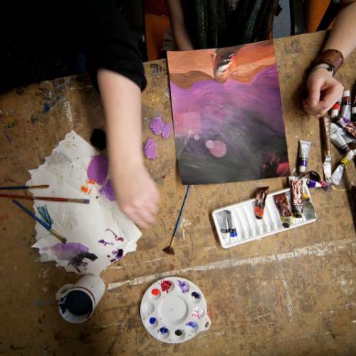 A student and professor work together on an Art & Design degree project