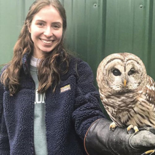 Grace DelRossa ’21 posing with an owl in her hand