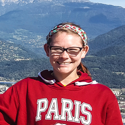 chelsea portrait standing in front of mountains